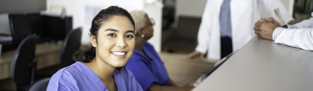 health worker at a reception desk